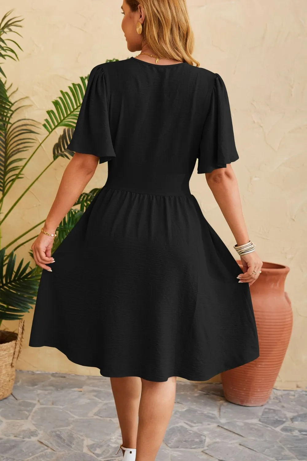 V-neck cinched waist flared sleeve fashionable dress