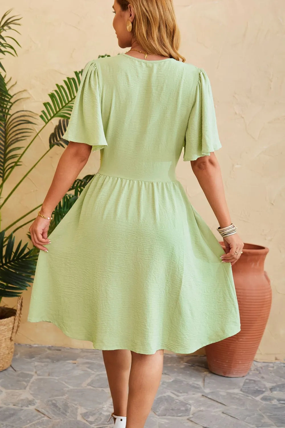 V-neck cinched waist flared sleeve fashionable dress
